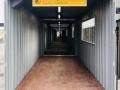Tunnel van doorloopcontainers bij bouwplaats | CBOX Containers
